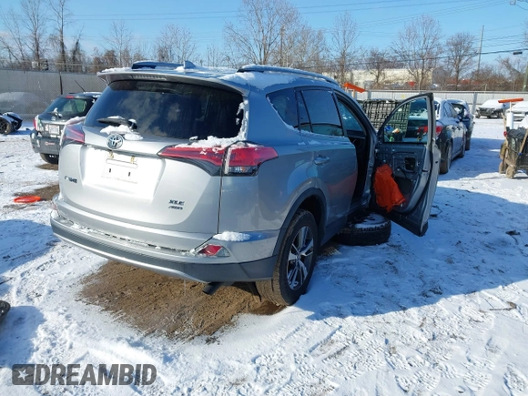 2018 Toyota RAV4 XLE with VIN 2T3RFREV8JW753853, listed as a IAAI auction lot 41526071 with 104,642 mi miles. Bid and sale history available at carsss.com. Image 4.