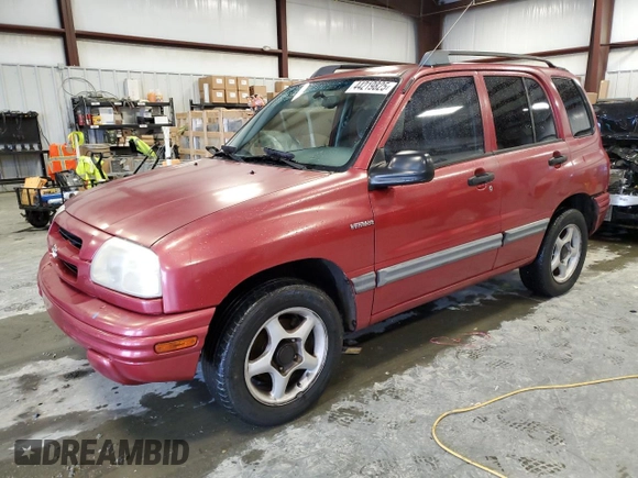 1999 Suzuki Vitara JLS z VIN 2S3TE52V6X6110719, wystawiony jako Copart lot #44219825 z przebiegiem 190 311 mil mil oraz Szkoda całkowita • Salvage title. Historia ofert i sprzedaży dostępna na DreamBid. Obrazek 1.