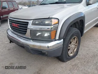 2009 GMC Canyon SLE1 z VIN 1GTDT13E398100890, wystawiony jako IAAI lot #42030572 z przebiegiem 160 181 mil mil oraz . Historia ofert i sprzedaży dostępna na DreamBid. Obrazek 6.