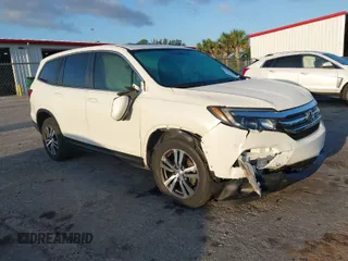 2017 Honda Pilot EX-L with VIN 5FNYF6H51HB037690, listed as a IAAI auction lot 41976359 with 126,055 mi miles and . Bid and sale history available at DreamBid. Image 1.