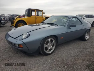 1983 Porsche 928 z VIN WP0ZZZ92ZDS841622, wystawiony jako Copart lot #76995304 z przebiegiem 83 862 mil mil oraz Szkody całkowita. Historia ofert i sprzedaży dostępna na DreamBid. Obrazek 1.