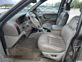 1999 Jeep Grand Cherokee Limited with VIN 1J4GW68S6XC713297, listed as a Copart auction lot 55264384 with 98,912 mi miles and Salvage Title. Bid and sale history available at carsss.com. Image 7.