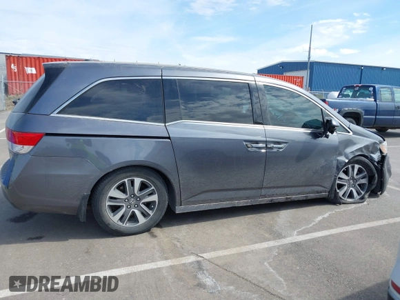 2014 Honda Odyssey Touring with VIN 5FNRL5H91EB093540, listed as a IAAI auction lot 41887412 with 202,076 mi miles and . Bid and sale history available at DreamBid. Image 13.