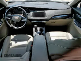 2023 Cadillac XT4 FWD Luxury with VIN 1GYAZAR46PF178003, listed as a Copart auction lot 59121545 with 42,000 mi miles and Salvage title. Bid and sale history available at DreamBid. Image 8.