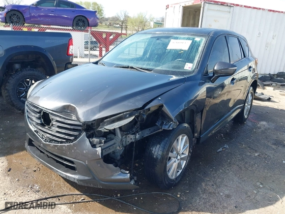 2016 Mazda CX-5 Touring with VIN JM3KE4CY3G0672977, listed as a IAAI auction lot 41889137 with 130,593 mi miles. Bid and sale history available at carsss.com. Image 18.
