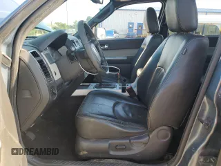 2010 Mercury Mariner Premier with VIN 4M2CN9HG7AKJ07163, listed as a Copart auction lot 62384925 with 113,591 mi miles and Salvage title. Bid and sale history available at DreamBid. Image 7.