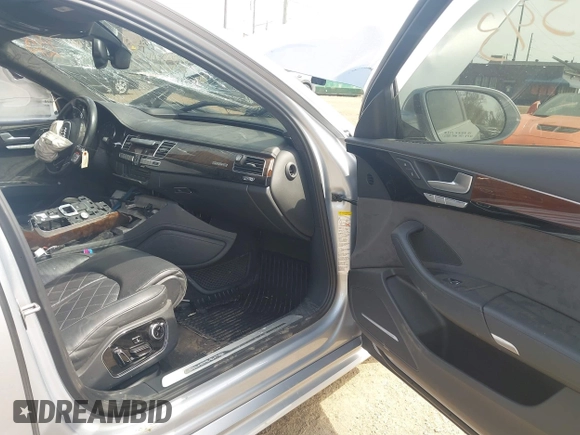 2016 Audi A8 Sport z VIN WAU43AFD0GN011518, wystawiony jako IAAI lot #42096343 z przebiegiem Nie podano mil oraz . Historia ofert i sprzedaży dostępna na DreamBid. Obrazek 5.