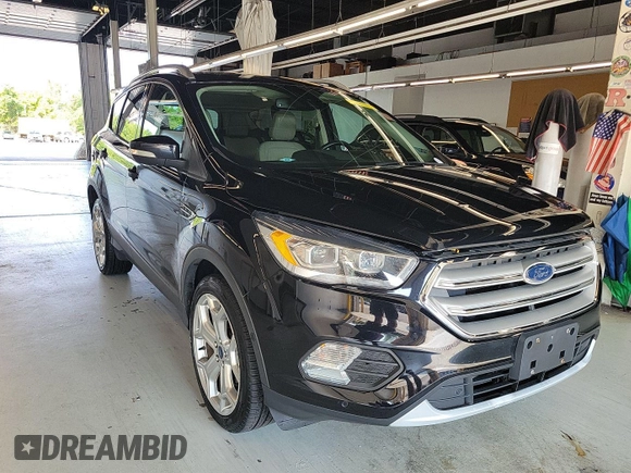 2019 Ford Escape Titanium with VIN 1FMCU9J96KUA01051, listed as a IAAI auction lot 42841649 with 69,720 mi miles and . Bid and sale history available at DreamBid. Image 4.