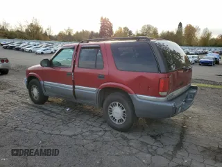 1999 GMC Jimmy SLE with VIN 1GKDT13W6X2508118, listed as a Copart auction lot 79761444 with 195,738 mi miles and Salvage Title. Bid and sale history available at carsss.com. Image 2.