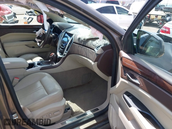 2016 Cadillac SRX Performance Collection z VIN 3GYFNCE39GS512286, wystawiony jako IAAI lot #42392467 z przebiegiem 95 708 mil mil oraz . Historia ofert i sprzedaży dostępna na DreamBid. Obrazek 5.