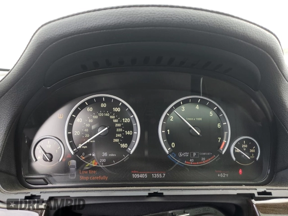 2013 BMW 7 Series 750i with VIN WBAYA8C57DC996498, listed as a Copart auction lot 52907415 with 109,405 mi miles and Salvage Title. Bid and sale history available at DreamBid. Image 9.