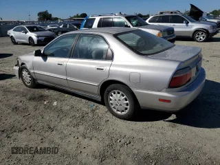 1997 Honda Accord EX with VIN 1HGCD5667VA025961, listed as a Copart auction lot 72125824 with 242,047 mi miles and Salvage Title. Bid and sale history available at carsss.com. Image 2.