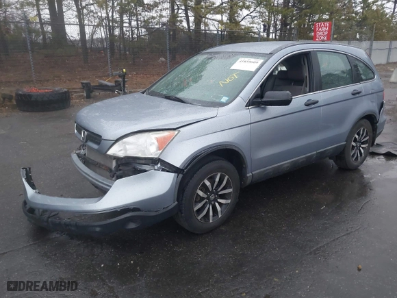 2009 Honda CR-V LX with VIN 5J6RE48319L052001, listed as a IAAI auction lot 41859609 with 220,909 mi miles. Bid and sale history available at carsss.com. Image 18.