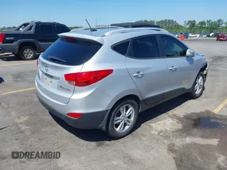 2013 Hyundai Tucson GLS with VIN KM8JU3AC3DU551018, listed as a IAAI auction lot 41988305 with 214,728 mi miles. Bid and sale history available at carsss.com. Image 4.