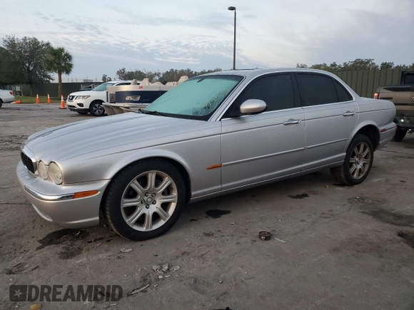 2004 Jaguar XJ with VIN SAJEA71C54SG01326, listed as a Copart auction lot 77449324 with 72,935 mi miles and Salvage Title. Bid and sale history available at carsss.com. Image 1.