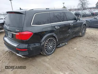 2014 Mercedes-Benz GL-Class GL 550 with VIN 4JGDF7DE1EA274612, listed as a IAAI auction lot 41710174 with 105,094 mi miles. Bid and sale history available at carsss.com. Image 4.
