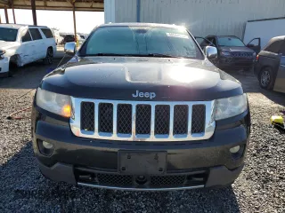 2013 Jeep Grand Cherokee Overland with VIN 1C4RJFCG2DC653207, listed as a Copart auction lot 48680885 with 276,020 mi miles and Salvage Title. Bid and sale history available at carsss.com. Image 5.