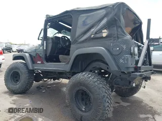2004 Jeep Wrangler Rubicon z VIN 1J4FA69S84P727716, wystawiony jako IAAI lot #42162129 z przebiegiem 90 844 mil mil oraz . Historia ofert i sprzedaży dostępna na DreamBid. Obrazek 3.