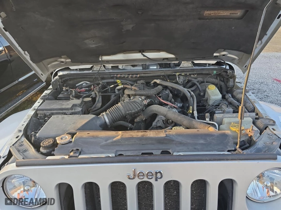 2011 Jeep Wrangler Unlimited Sahara with VIN 1J4BA5H16BL627992, listed as a Copart auction lot 49184625 with 197,845 mi miles and Clean Title. Bid and sale history available at carsss.com. Image 7.