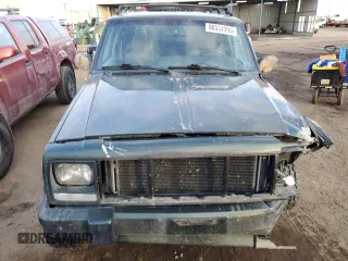 1997 Jeep Cherokee Country with VIN 1J4FJ78SXVL566804, listed as a Copart auction lot 88557395 with 216,230 mi miles and Salvage title. Bid and sale history available at DreamBid. Image 5.