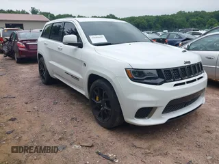 2021 Jeep Grand Cherokee Trackhawk with VIN 1C4RJFN95MC843131, listed as a IAAI auction lot 42688185 with 16,391 mi miles and . Bid and sale history available at DreamBid. Image 1.
