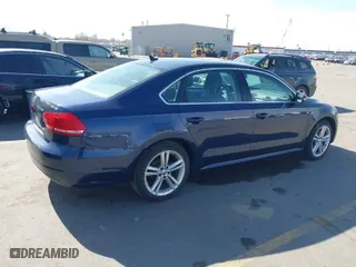 2014 Volkswagen Passat TDI SE w/Sunroof with VIN 1VWBN7A30EC055207, listed as a IAAI auction lot 41893637 with 133,074 mi miles. Bid and sale history available at carsss.com. Image 4.