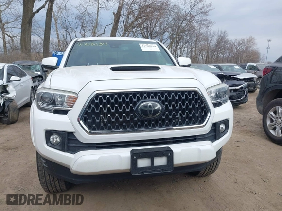 2018 Toyota Tacoma SR5 with VIN 3TMDZ5BN9JM051105, listed as a IAAI auction lot 41708034 with 98,000 mi miles and . Bid and sale history available at DreamBid. Image 12.