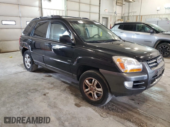 2005 Kia Sportage LX with VIN KNDJE723X57131795, listed as a Copart auction lot 79035214 with 146,746 mi miles and Salvage Title. Bid and sale history available at carsss.com. Image 4.