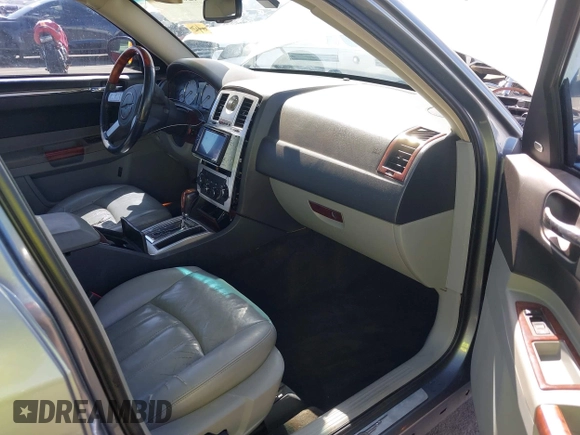 2006 Chrysler 300 C with VIN 2C3KA63H56H313967, listed as a IAAI auction lot 42056998 with 143,592 mi miles and . Bid and sale history available at carsss.com. Image 5.