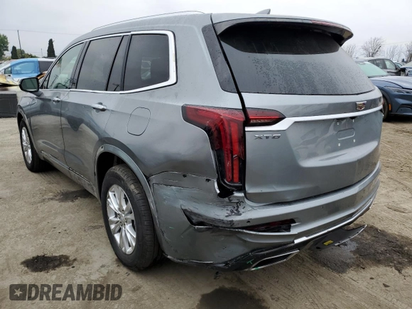 2023 Cadillac XT6 FWD Luxury z VIN 1GYKPAR47PZ147139, wystawiony jako Copart lot #50783595 z przebiegiem 27 684 mil mil oraz Szkoda całkowita • Salvage title. Historia ofert i sprzedaży dostępna na DreamBid. Obrazek 2.