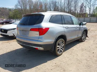 2017 Honda Pilot Touring with VIN 5FNYF6H98HB100335, listed as a IAAI auction lot 41907709 with 1 mi miles. Bid and sale history available at carsss.com. Image 4.