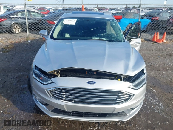 2017 Ford Fusion SE z VIN 3FA6P0HD4HR118826, wystawiony jako IAAI lot #40743513 z przebiegiem 130 038 mil mil oraz . Historia ofert i sprzedaży dostępna na DreamBid. Obrazek 6.