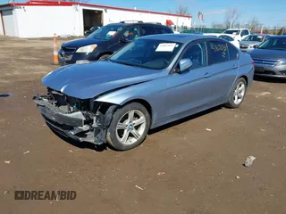2014 BMW 3 Series 328i with VIN WBA3C1C56EAV79706, listed as a IAAI auction lot 41807033 with 104,478 mi miles. Bid and sale history available at carsss.com. Image 2.