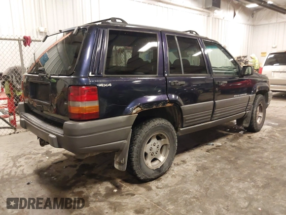 1997 Jeep Grand Cherokee Laredo with VIN 1J4GZ58S8VC675487, listed as a IAAI auction lot 41034046 with 243,284 mi miles. Bid and sale history available at carsss.com. Image 4.