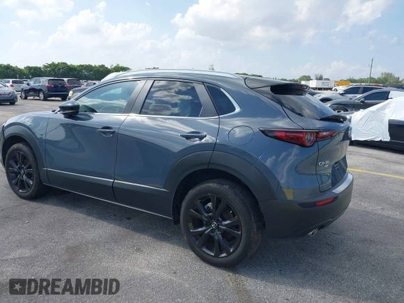 2023 Mazda CX-30 S Carbon Edition with VIN 3MVDMBCM4PM579080, listed as a IAAI auction lot 41941082 with 5,444 mi miles and . Bid and sale history available at DreamBid. Image 3.