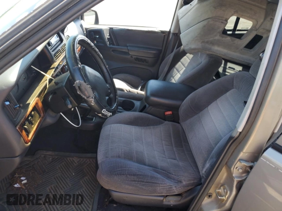 1997 Jeep Grand Cherokee Laredo with VIN 1J4GZ58S7VC505069, listed as a Copart auction lot 63255945 with 127,552 mi miles and Salvage title. Bid and sale history available at DreamBid. Image 7.