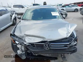 2013 Volkswagen Passat SE z VIN 1VWBP7A30DC144719, wystawiony jako IAAI lot #42174524 z przebiegiem 181 326 mil mil oraz . Historia ofert i sprzedaży dostępna na DreamBid. Obrazek 13.
