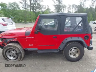 1999 Jeep Wrangler SE z VIN 1J4FY29P5XP487111, wystawiony jako IAAI lot #42125867 z przebiegiem 156 804 mil mil oraz . Historia ofert i sprzedaży dostępna na DreamBid. Obrazek 14.