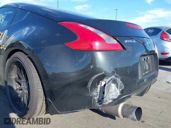 2016 Nissan 370Z with VIN JN1AZ4EH1GM933265, listed as a IAAI auction lot 41831484 with 98,193 mi miles. Bid and sale history available at carsss.com. Image 6.