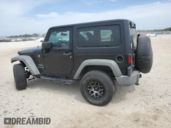 2015 Jeep Wrangler Sport with VIN 1C4AJWAG3FL723090, listed as a Copart auction lot 53325235 with 96,306 mi miles and Salvage title. Bid and sale history available at DreamBid. Image 2.