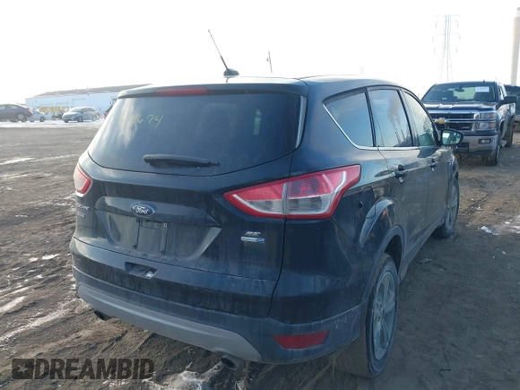 2014 Ford Escape SE with VIN 1FMCU9GX2EUD52176, listed as a IAAI auction lot 41628674 with 101,049 mi miles. Bid and sale history available at carsss.com. Image 4.