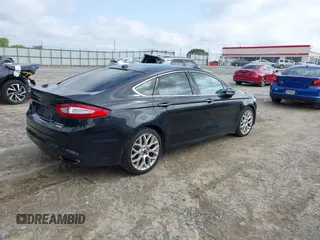 2013 Ford Fusion Titanium z VIN 3FA6P0K94DR375113, wystawiony jako IAAI lot #42265790 z przebiegiem 152 160 mil mil oraz . Historia ofert i sprzedaży dostępna na DreamBid. Obrazek 4.