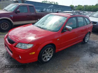 2003 Mazda Protege with VIN JM1BJ245231214946, listed as a IAAI auction lot 42163979 with 220,081 mi miles and . Bid and sale history available at DreamBid. Image 2.