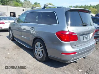 2014 Mercedes-Benz GL 450 with VIN 4JGDF7CE0EA290673, listed as a IAAI auction lot 42207889 with 132,251 mi miles and . Bid and sale history available at DreamBid. Image 3.