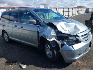 2007 Honda Odyssey EX with VIN 5FNRL384X7B119757, listed as a IAAI auction lot 41809763 with 163,526 mi miles and . Bid and sale history available at DreamBid. Image 1.