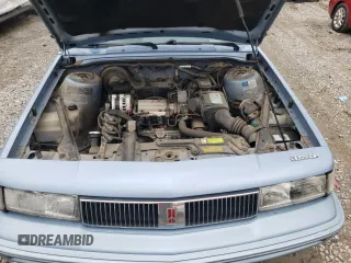 1993 Oldsmobile Cutlass Ciera S z VIN 1G3AG55N9P6451968, wystawiony jako Copart lot #72746634 z przebiegiem 88 151 mil mil oraz Szkody całkowita. Historia ofert i sprzedaży dostępna na DreamBid. Obrazek 11.