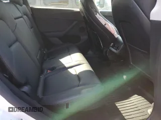 2023 Tesla Model Y Long Range z VIN 7SAYGDEE5PF785124, wystawiony jako Copart lot #56553785 z przebiegiem 31 341 mil mil oraz Szkoda całkowita • Salvage title. Historia ofert i sprzedaży dostępna na DreamBid. Obrazek 10.
