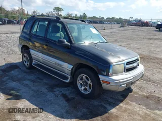 2001 Chevrolet Tracker LT z VIN 2CNBJ634316959811, wystawiony jako IAAI lot #41521952 z przebiegiem 176 933 mil mil oraz . Historia ofert i sprzedaży dostępna na DreamBid. Obrazek 1.