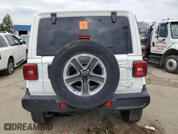 2023 Jeep Wrangler Sahara with VIN 1C4HJXEG6PW577427, listed as a Copart auction lot 57229185 with Not provided miles and Non repairable. Bid and sale history available at DreamBid. Image 6.