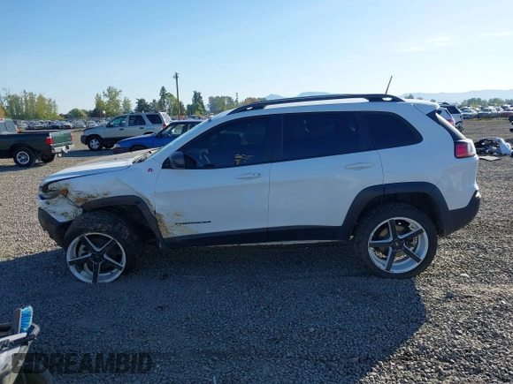 2021 Jeep Cherokee Trailhawk with VIN 1C4PJMBX9MD105888, listed as a IAAI auction lot 42065175 with 55,469 mi miles and . Bid and sale history available at DreamBid. Image 15.